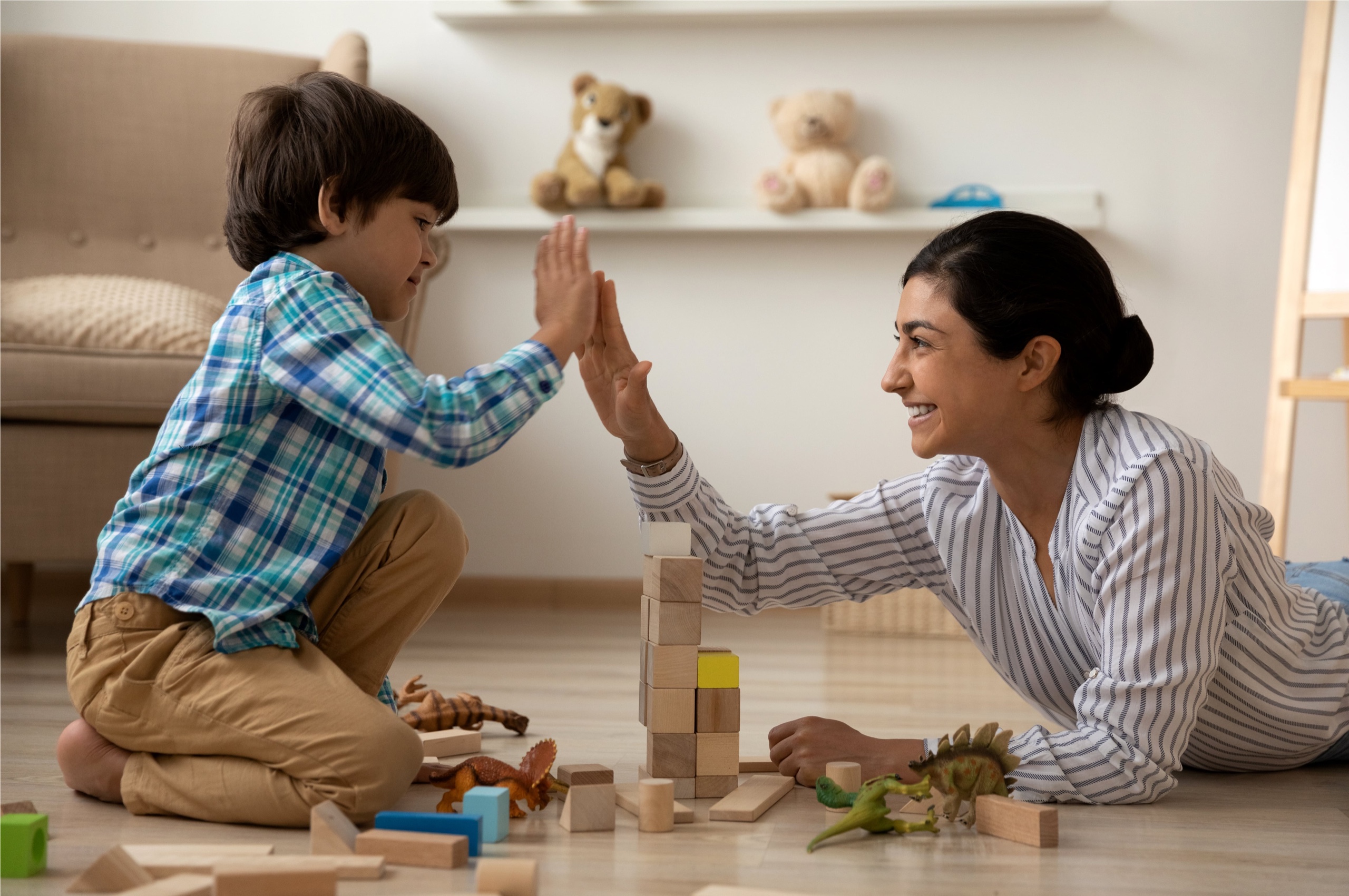 Mother high-fiving her son